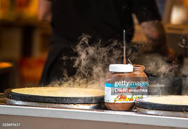 nutella pancakes cooking outdoors in copenhagen, denmark - nutella pancake stock pictures, royalty-free photos & images