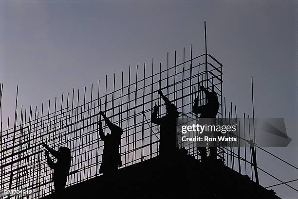 construction workers installing reinforcing bars - rod stock pictures, royalty-free photos & images