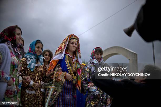 Emilia Pechinkova, a 24-years-old Bulgarian Pomak bride, is escorted by relatives ands friends during her three-day wedding ceremony in the village...