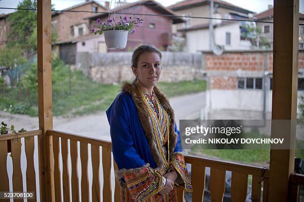 This picture taken on April 22 shows a Bulgarian Pomak bride Emilia Pechinkova, 24-years-old, posing prior the "gelina" or face painting for her...