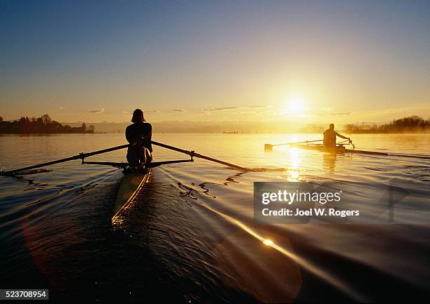 two scullers on calm lake washington - rowing fotografías e imágenes de stock