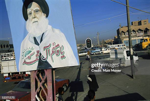 Painting of Mohammed Sadiq al-Sadr, revered Iraqi cleric and father of rebel cleric Moktada al-Sadr, hangs in Sadr City, the Shiite section of...