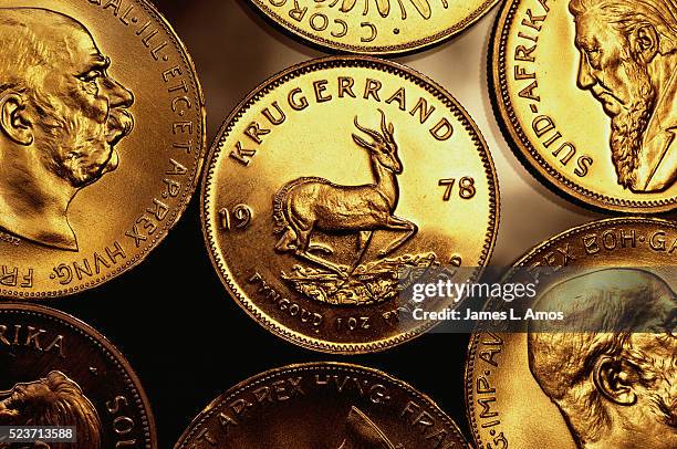 gold krugerrand coins - gold coin stock-fotos und bilder