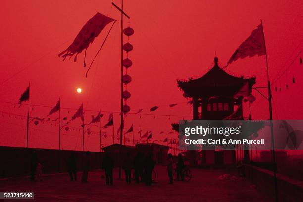 banners and tower on xian city wall - xi'an stock pictures, royalty-free photos & images