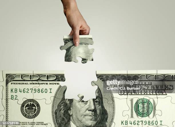 100 dollar pill puzzle being put together - pension money stock pictures, royalty-free photos & images