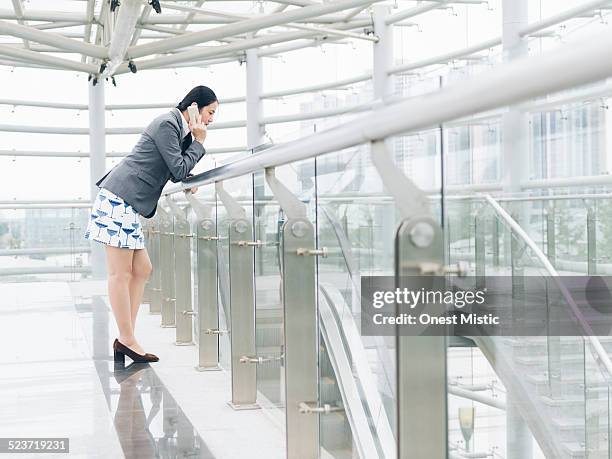 asian businesswoman talking on celphone - celphone stock pictures, royalty-free photos & images