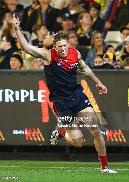 Sam Frost of the Demons celebrates after kicking a goal during the round five AFL match between the Melbourne Demons and the Richmond Tigers at...