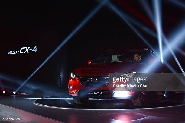 Mazda China introduces CX-4 during the Pre-Event For Beijing Motor Show - Auto China on April 24, 2016 in Beijing, China. Mazda China unveiled the...