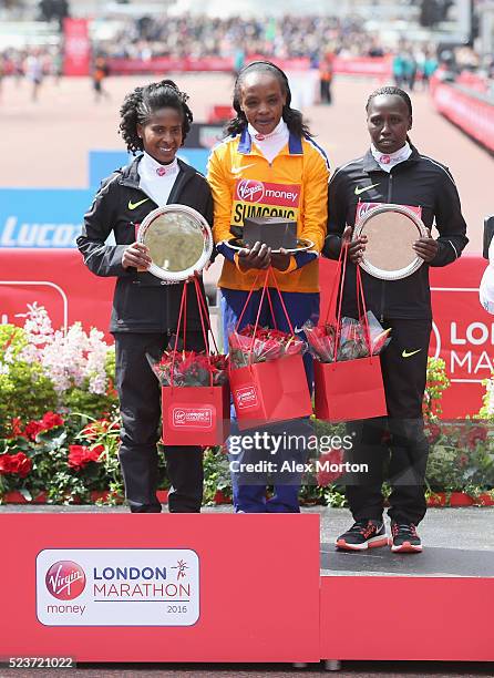 Elite womens winner Jemima Sumgong of Kenya, second place Tigist Tufa of Ethiopia and third place Florence Kiplagat of Kenya after the Virgin Money...