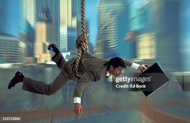 executive at the end of his rope - swing stock pictures, royalty-free photos & images