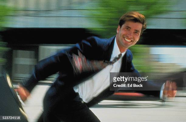 cheerful businessman with briefcase running - urgency stock pictures, royalty-free photos & images