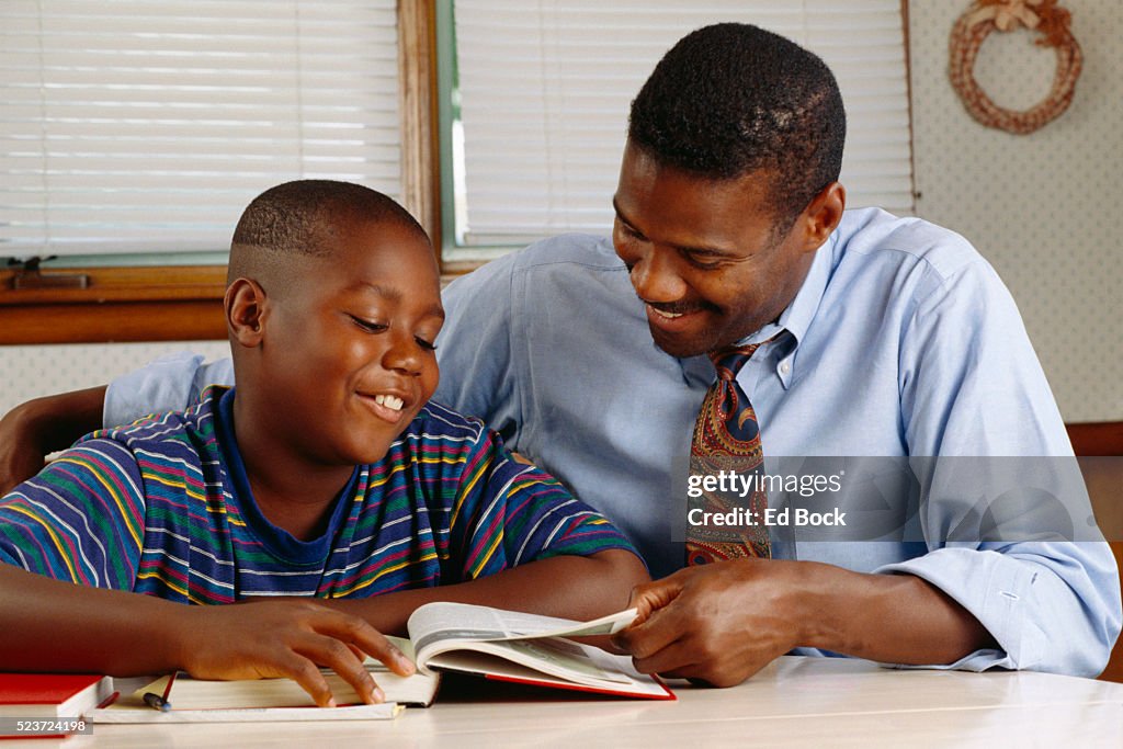 Father helping his son with homework