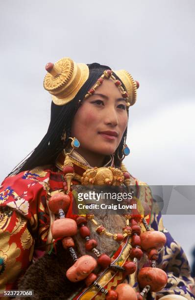 khampa woman in traditional attire at litang horse festival - khampa stock pictures, royalty-free photos & images