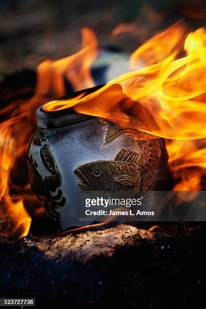 raku fired pottery in flames - centreville stock pictures, royalty-free photos & images