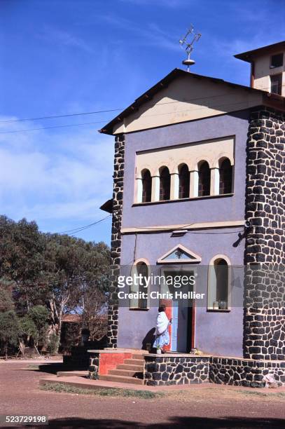 churchgoer outside orthodox church - asmara eritrea stock pictures, royalty-free photos & images