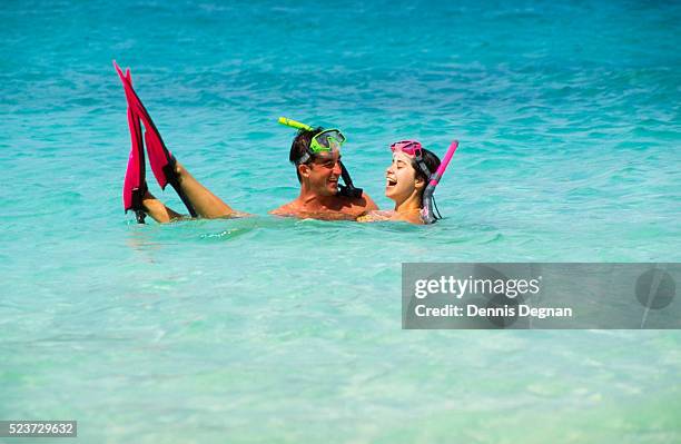 couple snorkeling - bermuda stock pictures, royalty-free photos & images
