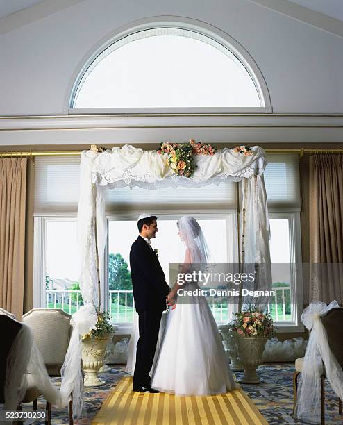 bride and groom under huppah - vintage wedding stock pictures, royalty-free photos & images