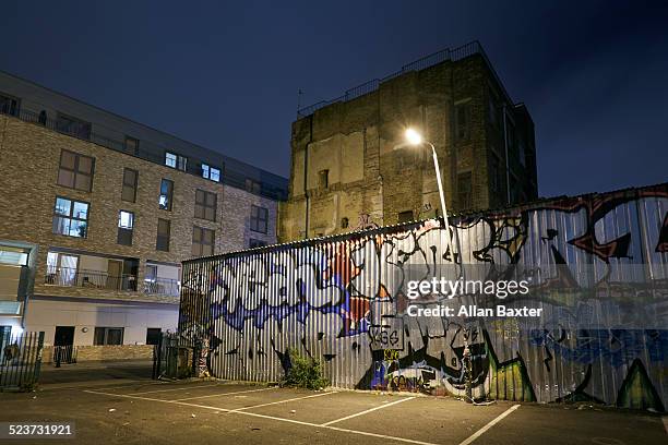 street art at night in brisk lane - brick lane graffiti stock pictures, royalty-free photos & images