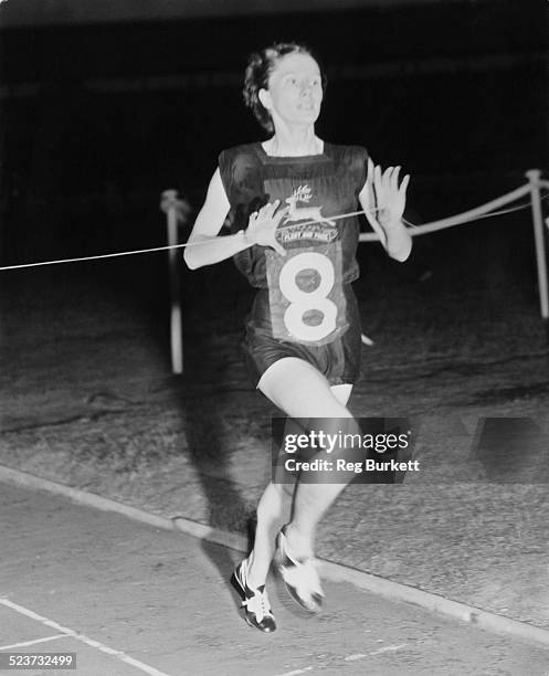 British runner Diane Leather winning the One Mile event at the International Athletic Meeting at White City, London, 21st September 1955. She beat...