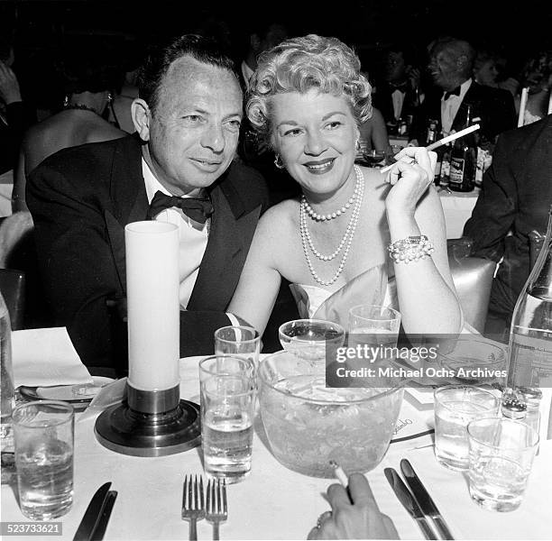 Actress Claire Trevor and and husband Milton H. Bren attend the movie premiere party of "High and Mighty" in Los Angeles,CA.