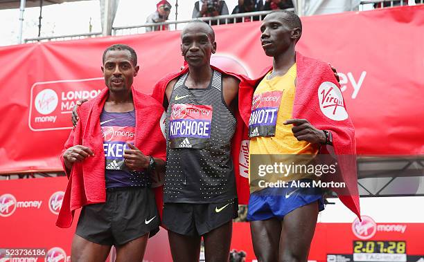 Elite mens winner Eluid Kipchoge of Kenya , second place Stanley Biwott of Kenya and third place Kenenisa Bekele of Ethopia pose after the Virgin...