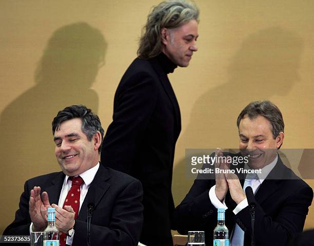 British Prime Minister Tony Blair and Chancellor Gordon Brown applaud Sir Bob Geldof after his speech at the launch of the Commission for Africa,...