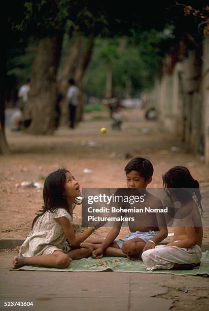 kids playing pick-up sticks - mikado stock pictures, royalty-free photos & images