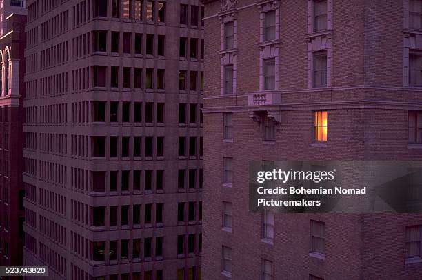 lighted hotel window - the nomad hotel stock pictures, royalty-free photos & images