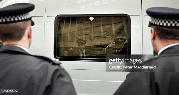 Police van believed to be carrying terror suspects arrives at The Special Immigration Appeal Commission on March 11, 2005 in London, England. Five...