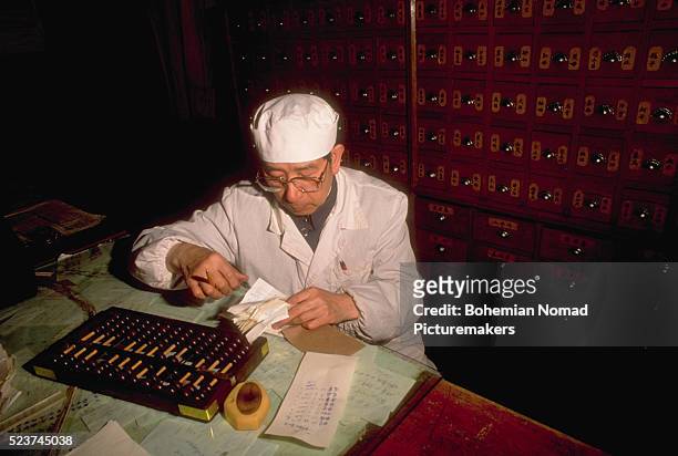 spice merchant using abacus - accounting abacus stock pictures, royalty-free photos & images