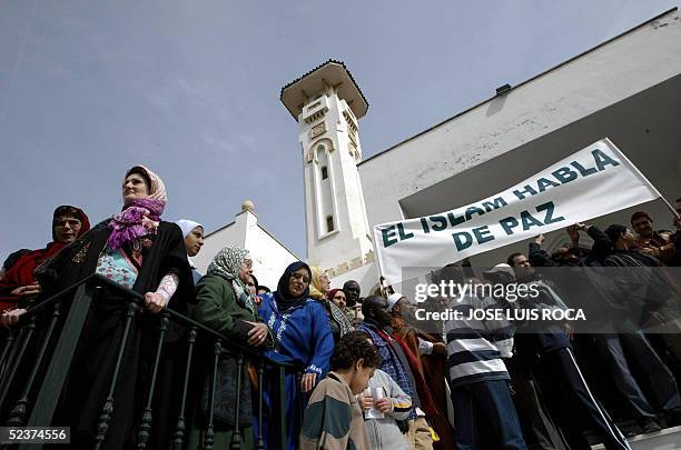 Moroccans residents in Spain observe five-minute silence in memory of the 191 people killed one year ago in the March 11 train bombings in Madrid 11...