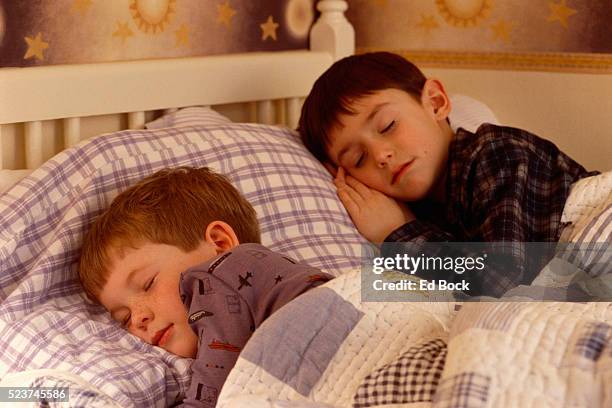 boys sleeping in bed - slumber party stock pictures, royalty-free photos & images