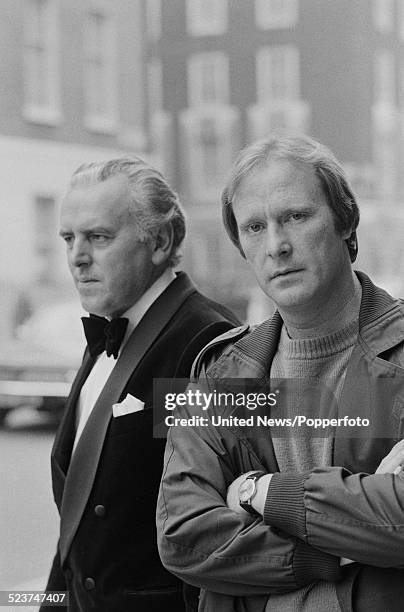 English actors George Cole and Dennis Waterman pictured together in character as Arthur Daley and Terry McCann during filming of the television...