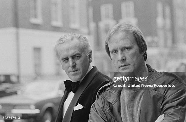 English actors George Cole and Dennis Waterman pictured together in character as Arthur Daley and Terry McCann during filming of the television...