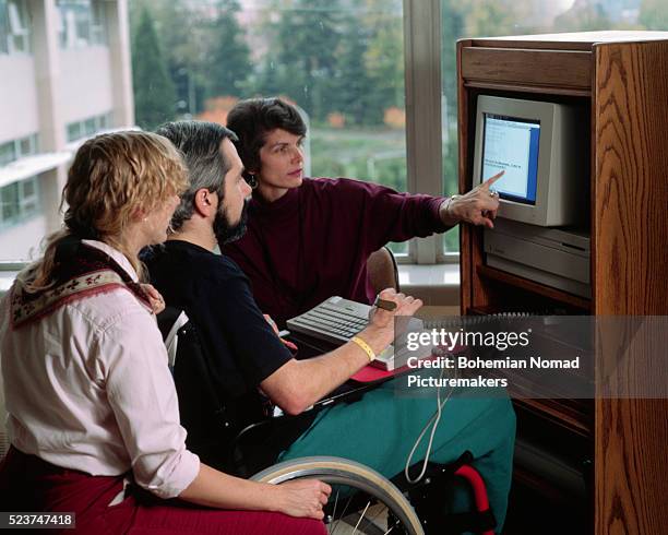 therapists working with paralyzed patient - quadriplegic stock-fotos und bilder
