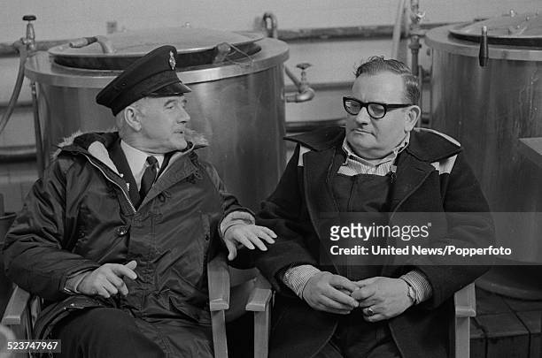 British actors Fulton Mackay and Ronnie Barker pictured in character as Mr. Mackay and Norman Stanley Fletcher on the set of the feature film version...
