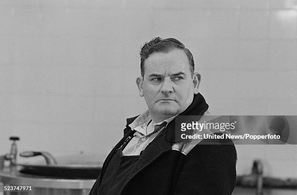 English actor Ronnie Barker pictured in character as Norman Stanley Fletcher on the set of the feature film version of the television series Porridge...