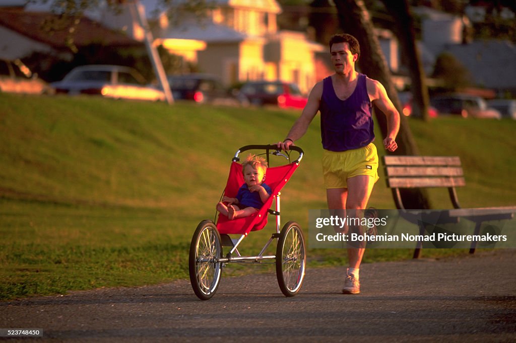 Running With Baby Father Running With Babyjogger High-Res Stock Photo - Getty Images
