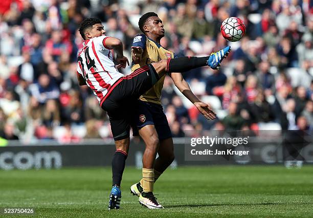 Alex Iwobi of Arsenal battle for the ball DeAndre Yedlin of Sunderland during the Barclays Premier League match between Sunderland and Arsenal at the...