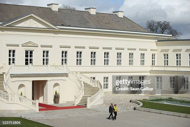German Chancellor Angela Merkel and U.S. President Barack Obama emerge from Schloss Herrenhausen palace upon Obama's arrival on April 24, 2016 in...