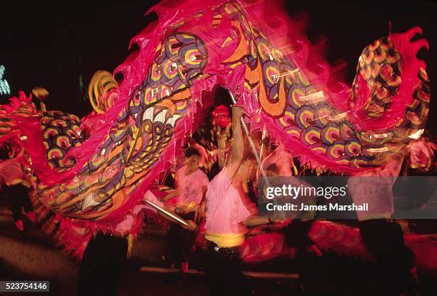 chinese dragon dancers at chingay parade - dragon dance stock-fotos und bilder