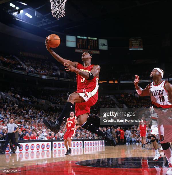 Al Harrington of the Atlanta Hawks drives to the basket for a layup during a game against the Portland Trail Blazers at The Rose Garden on February...