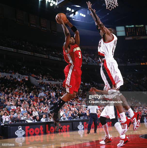 Josh Smith of the Atlanta Hawks drives to the basket against Theo Ratliff of the Portland Trail Blazers during a game at The Rose Garden on February...