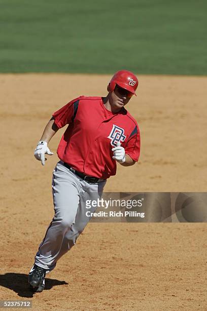 Brad Wilkerson of the Washington Nationals rounds the bases after hitting a home run during the Spring Training game against the Baltimore Orioles at...