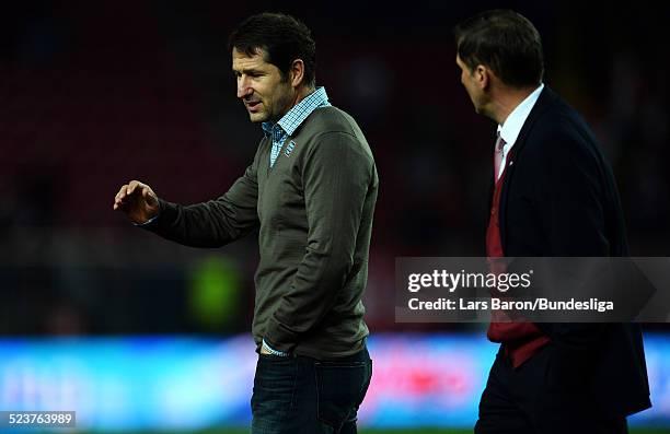 Head coach Franco Foda and manager Stefan Kuntz of Kaiserslautern are looking dejected after loosing the Bundesliga Playoff second leg match between...