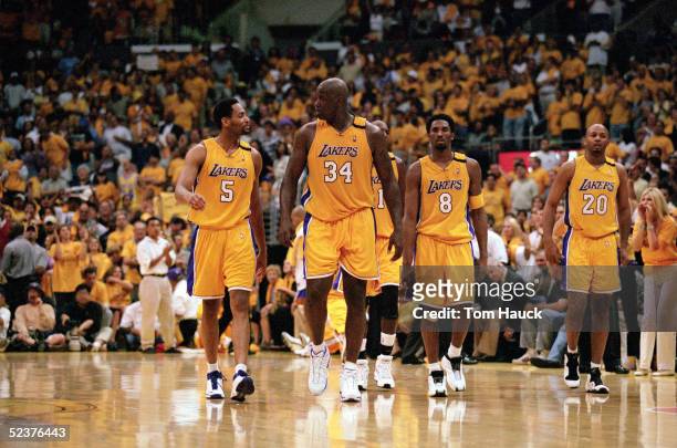 Robert Horry, Shaquille O'Neal, Kobe Bryant and Brian Shaw of the Los Angeles Lakers walk on the court during Game 7 of the Western Conference Finals...