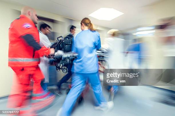 blurred emergency in hospital - rescue worker stockfoto's en -beelden