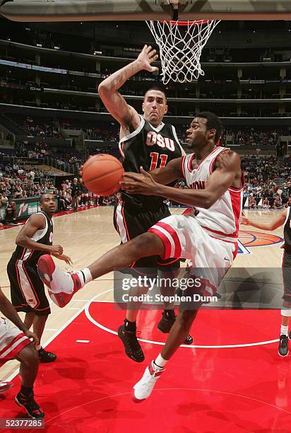 Jawann McClellan of the Arizona Wildcats attempts a layup past Nick Dewitz of the Oregon State Beavers during the 2005 Pacific Life Pac-10 Men's...