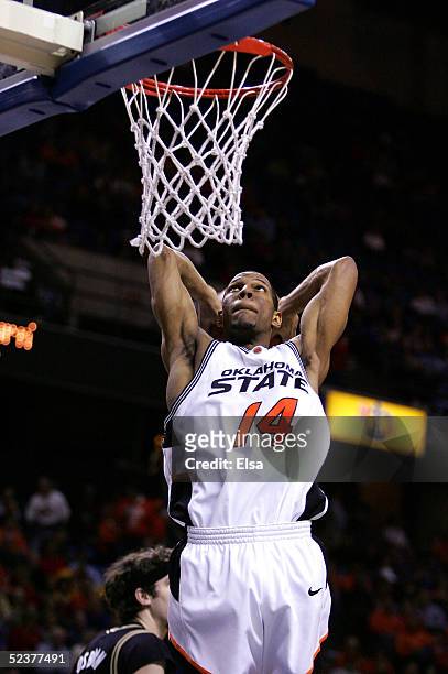 Joey Graham of the Oklahoma State Cowboys goes up for a slam dunk in the second half against the Colorado Buffaloes in Day 2 of the Phillips 66 Big...