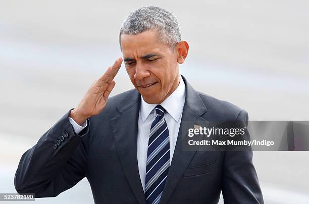 President Barack Obama salutes as he walks from Marine One before departing from Stansted Airport after a four day visit to the UK, on April 24, 2016...